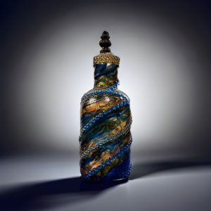 A blue glass bottle with a decorative top.