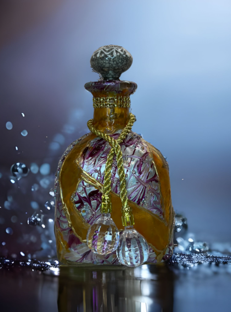 A bottle of perfume sitting on top of a table.