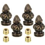 A set of six brass knobs with gold metal inserts.