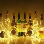 A group of bottles and lights on the table.