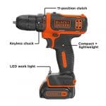 A black and decker drill with the light on.