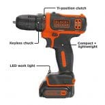 A black and decker drill with the light on.