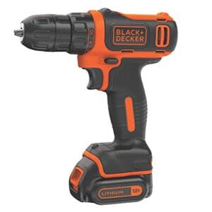 A black and decker drill with an orange handle.