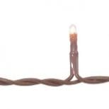 A brown string of lights with a candle on top.