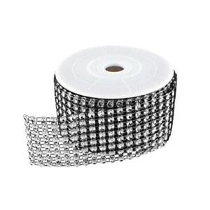 A roll of black and white ribbon with silver rhinestones.