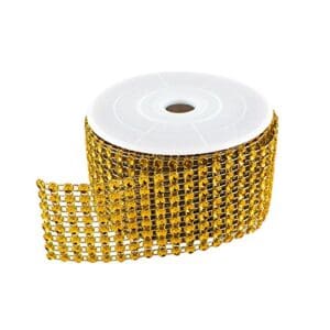 A roll of gold ribbon with a white background