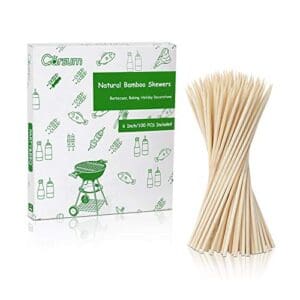 A box of bamboo skewers with a bunch of sticks