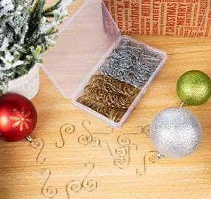 A wooden table with some ornaments and a box of metal wire.