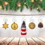 A wooden table with ornaments hanging from it.