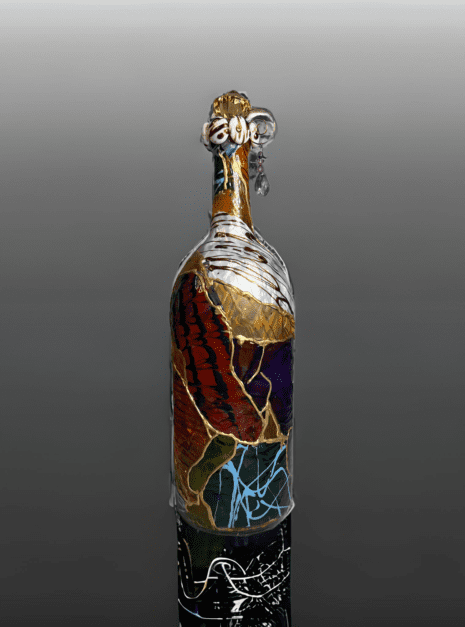 A bottle of wine with some kind of decoration on it