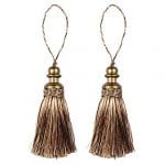 A pair of tassels with gold metal tips.