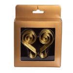 A pair of gold colored metal swirls in a box.