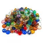 A pile of colorful glass pebbles on top of each other.