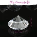 A diamond shaped crystal is shown with the size of it.