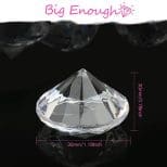 A diamond shaped crystal is shown with the size of it.