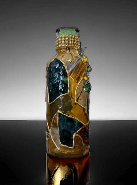 A bottle with some kind of art work on it