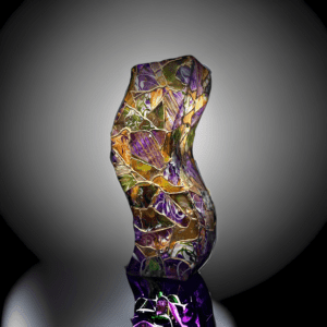 A glass sculpture of a colorful piece of art.