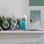 A mantle with some ornaments and a picture