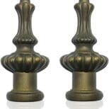 A pair of antique brass lamps with fluted tops.