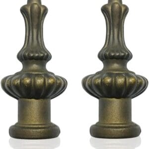 Two antique bronze finials with ornate designs on a white background.