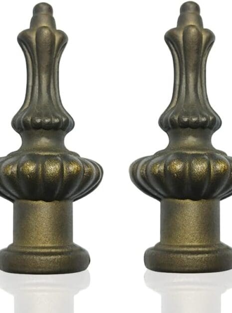 A pair of antique brass lamps with fluted tops.