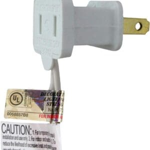 A white outlet with a caution tag attached to it.