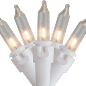 A cluster of 10 Ct white Christmas lights with a glowing filament, set against a plain background.