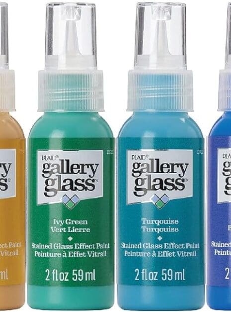 A group of four bottles with different colors.