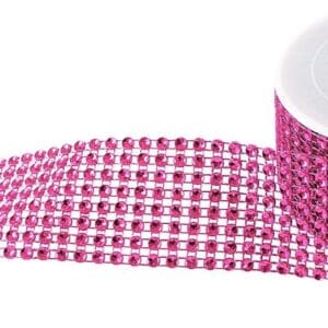 A roll of Bling Ribbon Fushia with sequins, partially unrolled, isolated on a white background.