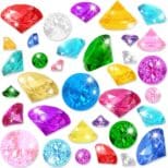 A bunch of different colored diamonds are on the floor