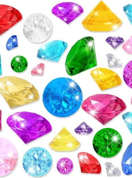 A bunch of different colored diamonds are on the floor