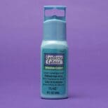 A bottle of blue paint on a purple background.