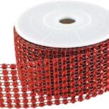 A roll of red ribbon with black and white dots.