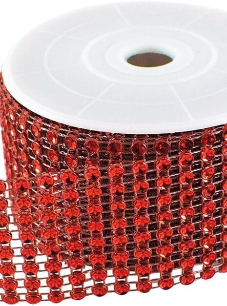 A roll of red ribbon with black and white dots.