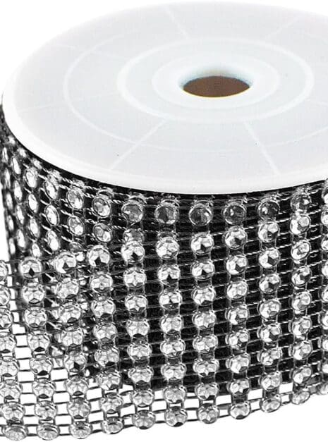 A roll of black and silver ribbon with many rows of beads.