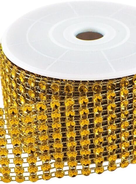 A roll of gold ribbon with black and white diamond pattern.