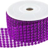 A roll of purple ribbon with many rows of beads.