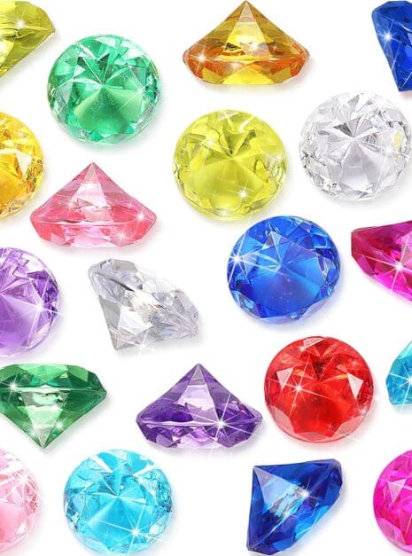 A bunch of different colored gems are sitting on the floor