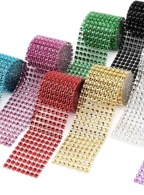 81zkBMHwTnS._AC_SL1500_ A group of different colored rolls of rhinestone ribbon.