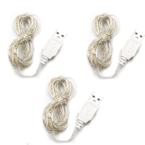 Four coiled transparent Glitter cables with silver wires visible, arranged neatly on a white background.