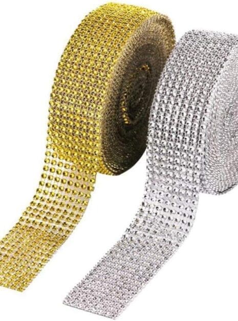 A roll of gold and silver ribbon with many rows of rhinestones.