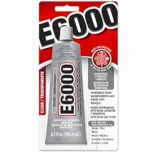E6000 industrial strength adhesive in a squeeze tube with red and black packaging.