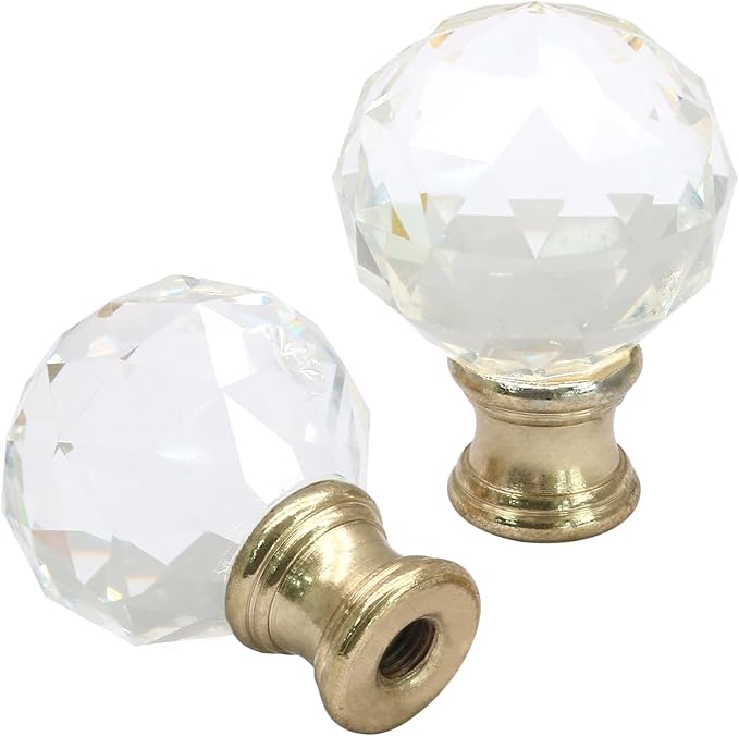 Two clear crystal cabinet knobs with brass bases. Two clear crystal cabinet knobs with brass bases.
